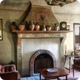 Father Jaume and his staff share this beautiful Living room.  The fireplace features antique Spanish tile and pottery.