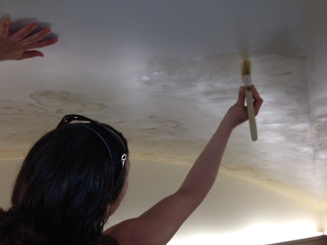 My friend, Marianne Ward, applying a hand-wrought antique glaze to the Grand Foyer ceiling...increasing the degree of rich, elegant impact.    