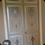 52  Hand-painted ornamental detailing on foyer closet doors