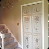 85  Foyer; Custom Ornamental Detail on Coat Closet Doors