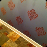 157  Copper damask finish for a powder room.