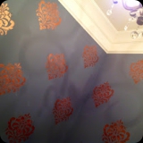 158  Copper damask finish for a powder room.