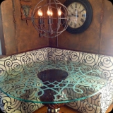 39  Ornamental etched glass table top for a breakfast nook.