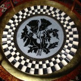 18  Custom thistle motif etched into mirror.  Former wall mirror used as a decorative insert set under coffee table glass top & as a serving tray.