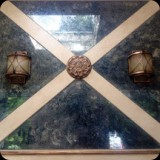 23  Applied antique mirror patina to 4 pieces of custom cut mirror - installed above mantle with sconces & wood trim accents.