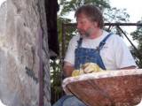 Hand-packing the new mortar to secure the stone in place for another 200 years!