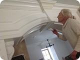 Aunt Delores painting the main arch between living room & kitchen.