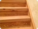 The original schoolhouse floorboards - milled and repurposed into steps to the upstairs loft.